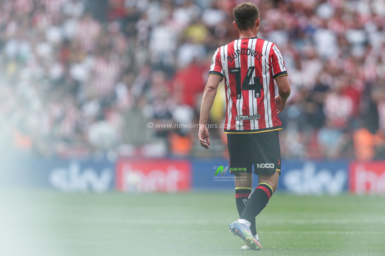 Harrison Burrows of Sheffield United with flare behind him during the Sky Bet Championship Playoff Final match Sheffield United vs Sunderland at Wembley Stadium, London, United Kingdom, 24th May 2025

(Photo by Izzy Poles/News Images)