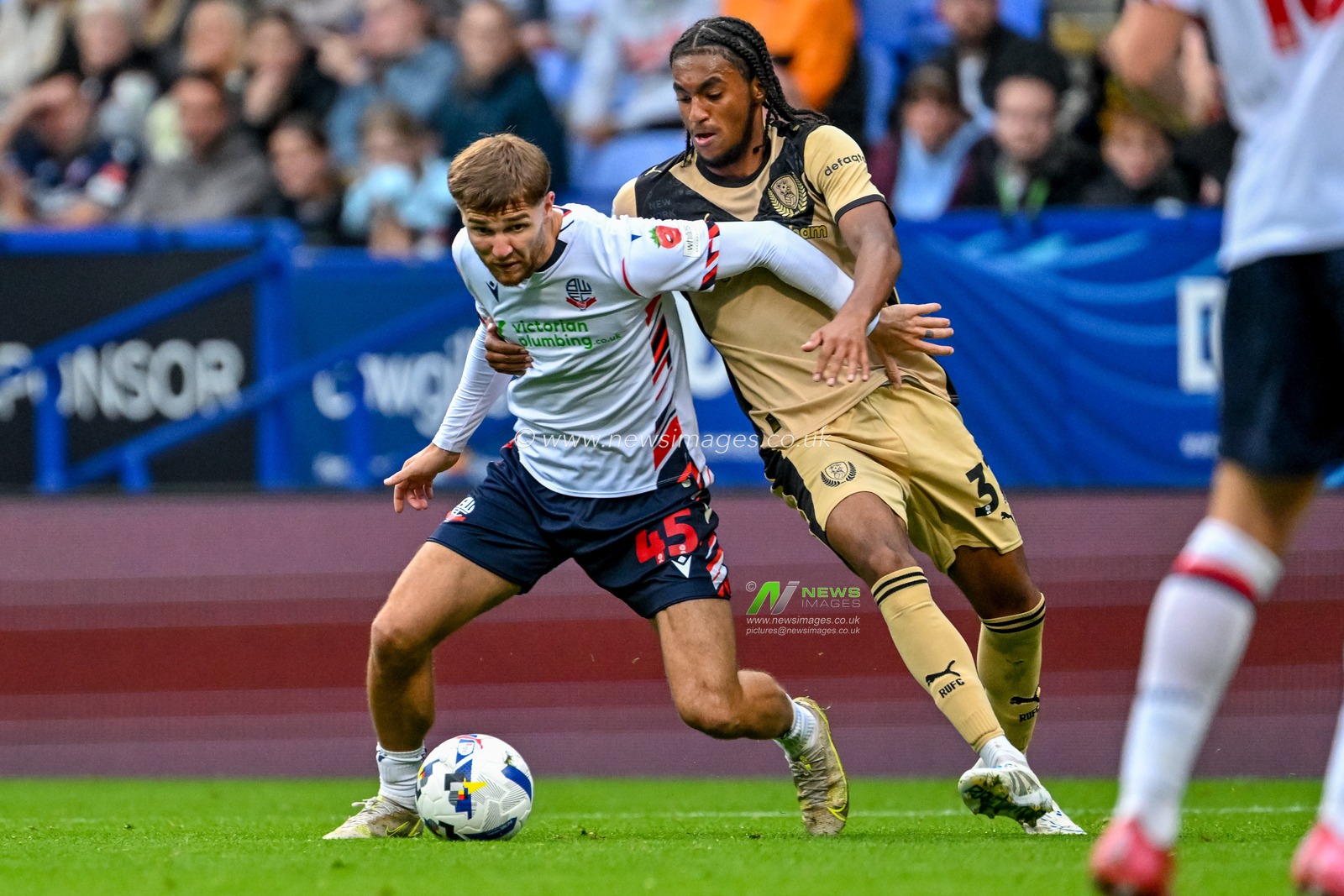 Tom Holmes of Rotherham United   battles with Zak Jules of Rotherham United during the The Vertu Trophy match Bolton Wanderers vs Rotherham United at Toughsheet Community Stadium, Bolton, United Kingdom, 2nd September 2025

(Photo by Adam Gee/News Images)