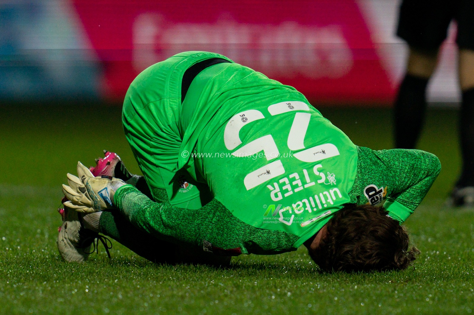 Jed Steer #25 of Luton Town is injured and has to be stretchered off