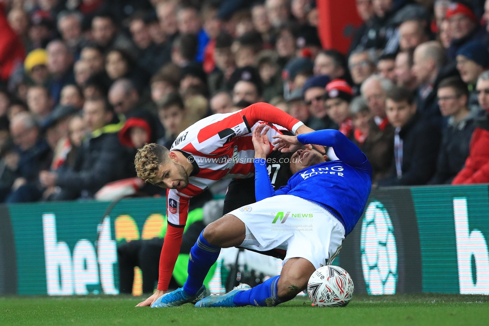 25th January 2020, Griffin Park, London, England; Emirates FA Cup, Brentford v Leicester City : Emiliano Marcondes (17)of Brentford fouls  James Justin (02) of Leicester City