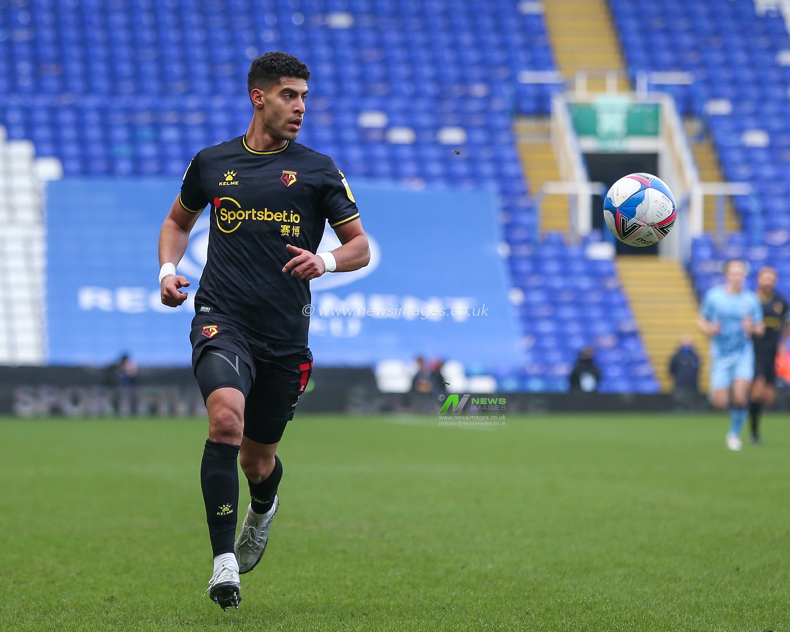 Adam Masina #11 of Watford dribbles the ball