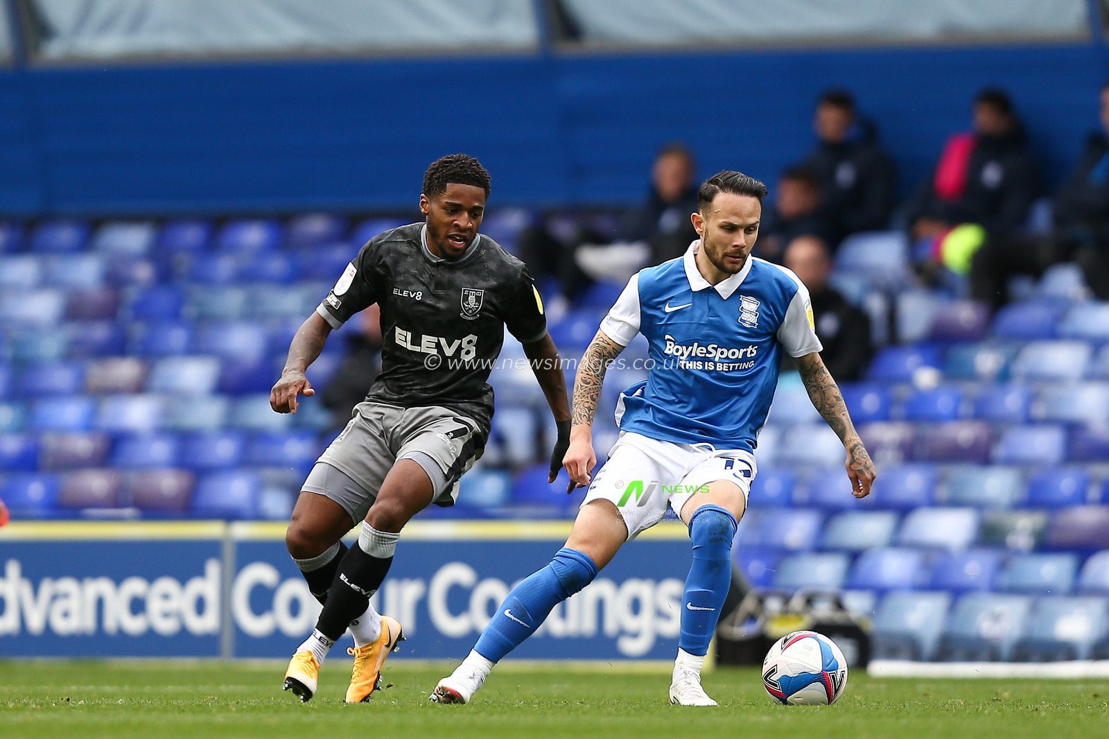 Ivan Sanchez (17) of Birmingham City keeps the ball away from Kadeem Harris (7) of Sheffield Wednesday