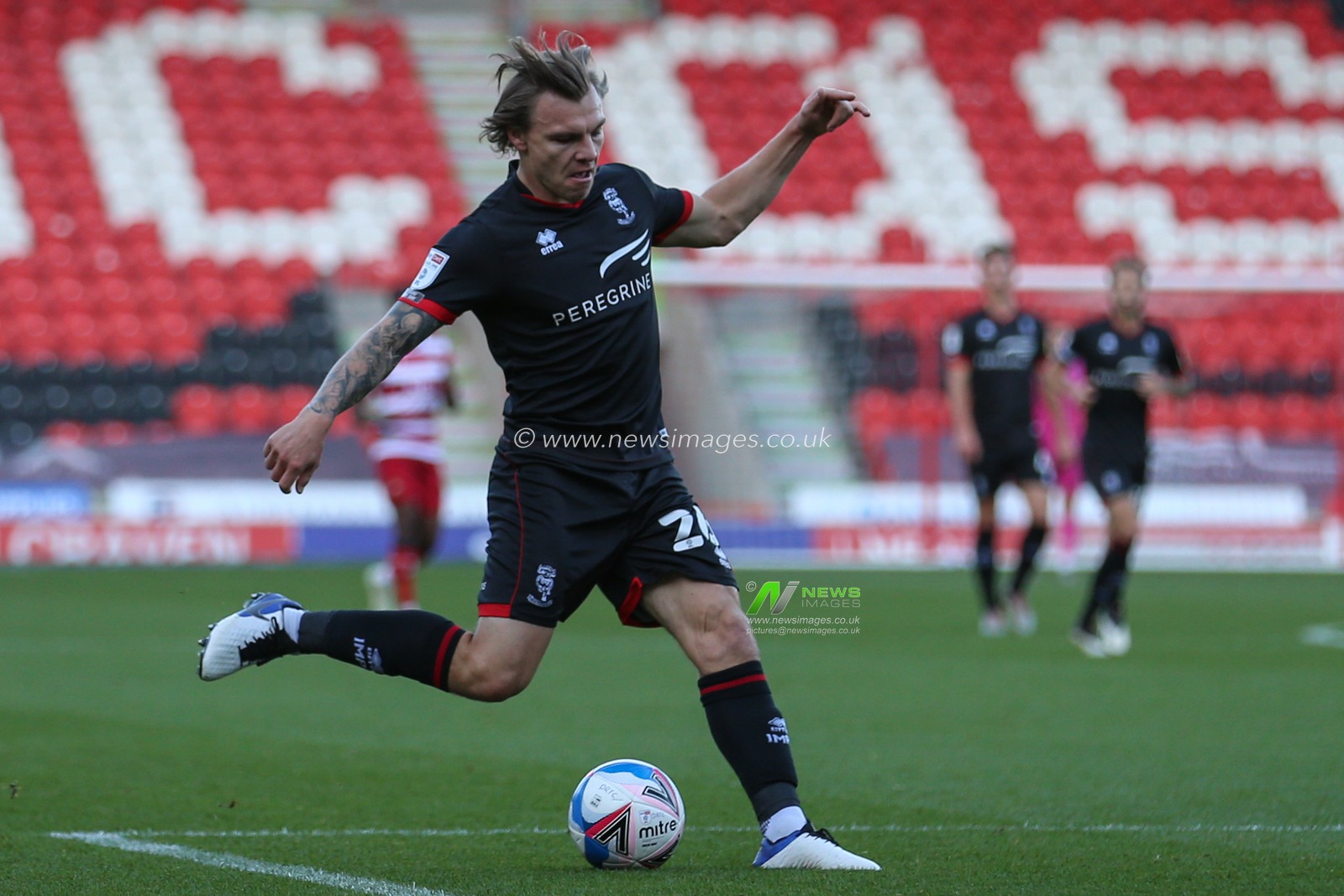 Harry Anderson (26) of Lincoln City in action during the game