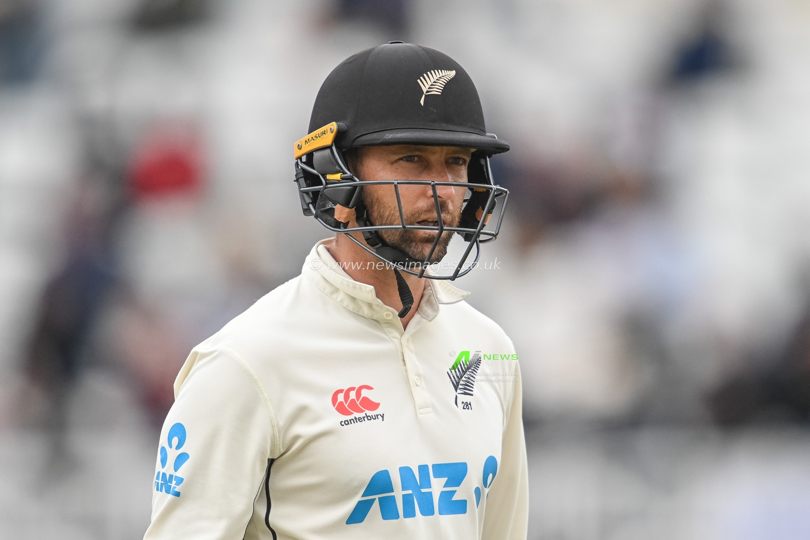 Devon Conway of New Zealand leaves the field after being caught by Jonny Bairstow of England