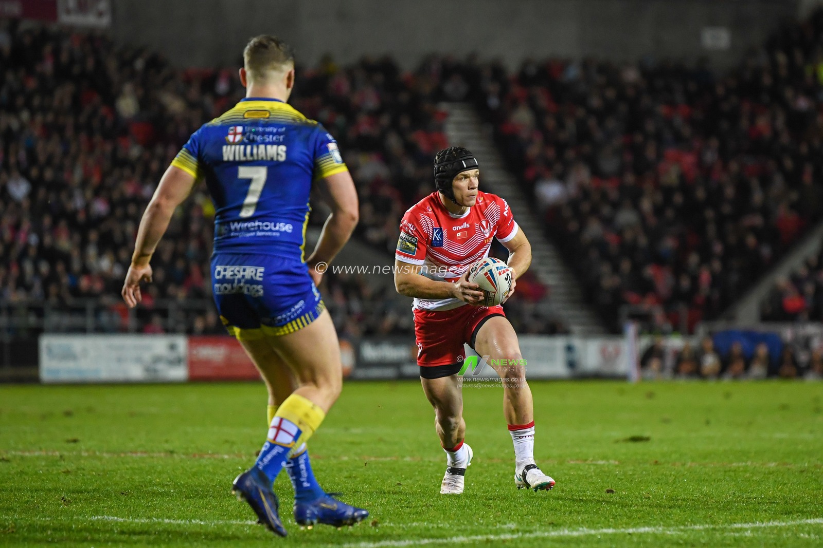 Jonny Lomax #6 of St Helens looks for a pass