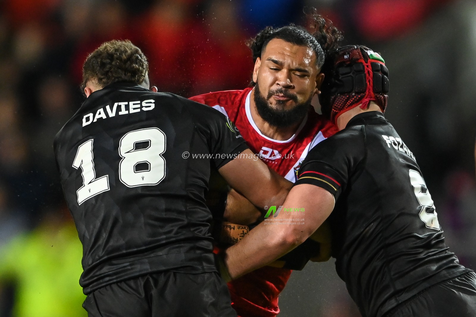 Ben Murdoch-Masila of Tonga is tackled by Curtis Davies of Wales  during the Rugby League World Cup 2021 match Tonga vs Wales at Totally Wicked Stadium, St Helens, United Kingdom, 24th October 2022

(Photo by Craig Thomas/News Images)