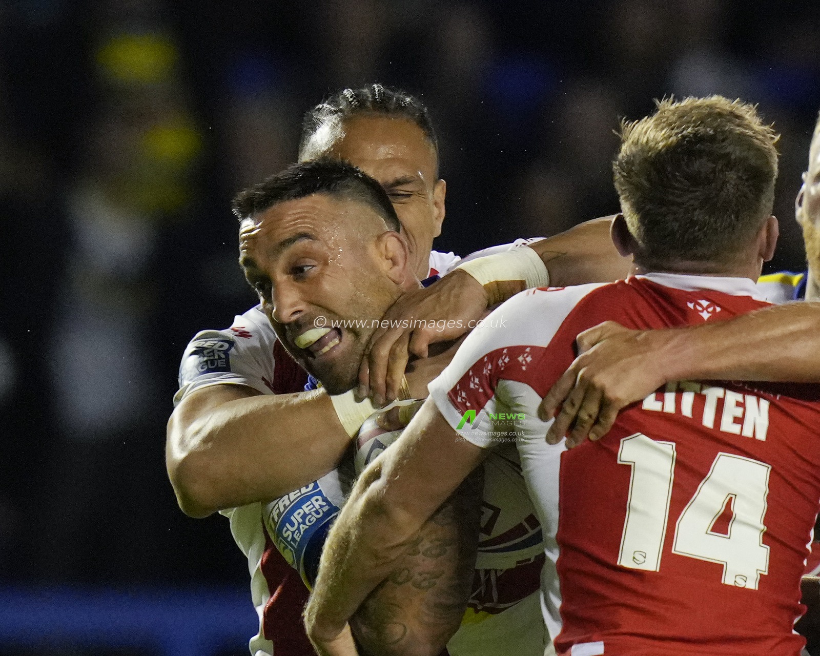 Paul Vaughan #10 of Warrington Wolves =s held by Sauaso â€˜Jesseâ€™ Sue #8 of Hull KR during the Betfred Super LeagueRound 12 match Warrington Wolves vs Hull KR at Halliwell Jones Stadium, Warrington, United Kingdom, 12th May 2023

(Photo by Steve Flynn/News Images)