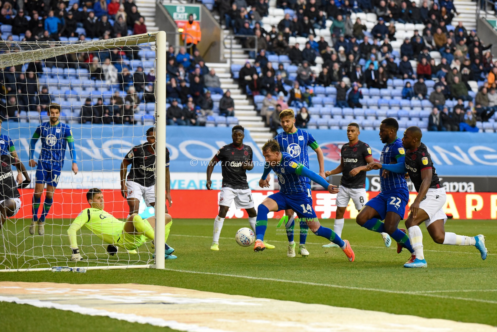 30th November 2019, DW Stadium, Wigan, England; Sky Bet Championship, Wigan Athletic v Reading : Joe Garner (14) of Wigan Athletic scores a goal to make it 1-0

Credit: Simon Whitehead/News Images