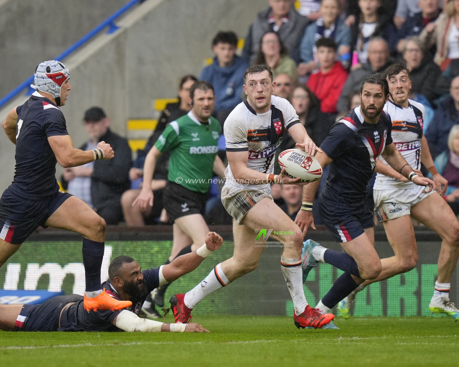Jake Wardle #4 of England makes a break past Samisoni Langi #3 of France during the Mid Season International match England vs France at Halliwell Jones Stadium, Warrington, United Kingdom, 29th April 2023

(Photo by Steve Flynn/News Images)