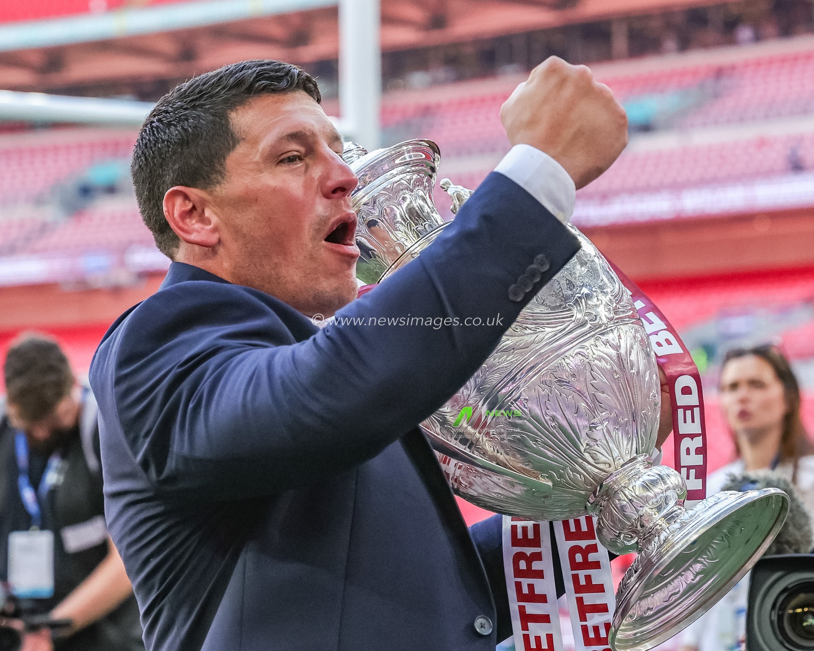 Matt Peet head coach of Wigan Warriors lifts the  Betfred Challenge Cup Trophy up to the fans as he celebrates the win during the Betfred Challenge Cup Final match Wigan Warriors vs Hull KR at Wembley Stadium, London, United Kingdom on 30 May 2026

(Photo by Mark Cosgrove/News Images)