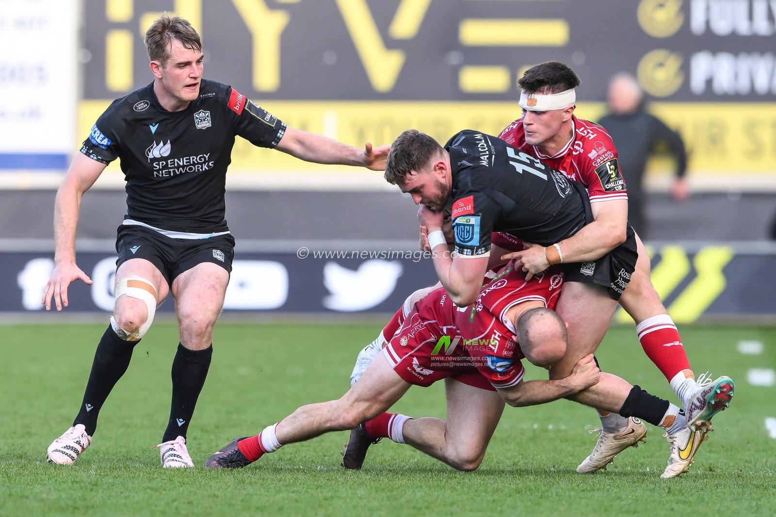 Ollie Smith of Glasgow warriors is tackle by Ioan Nicholas and Joe Roberts of Scarlets during the European Challenge Cup Semi-Final match Llanelli Scarlets vs Glasgow Warriors at Parc y Scarlets, Llanelli, United Kingdom, 29th April 2023

(Photo by Craig Thomas/News Images)