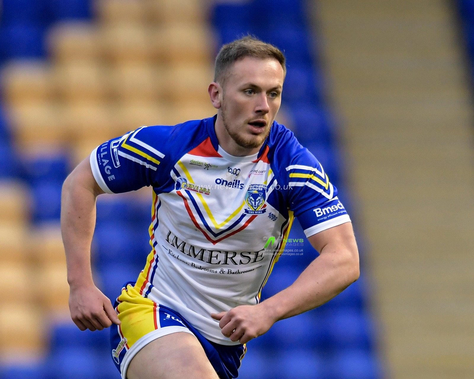 Ben Currie (11) of Warrington Wolves in action during the game