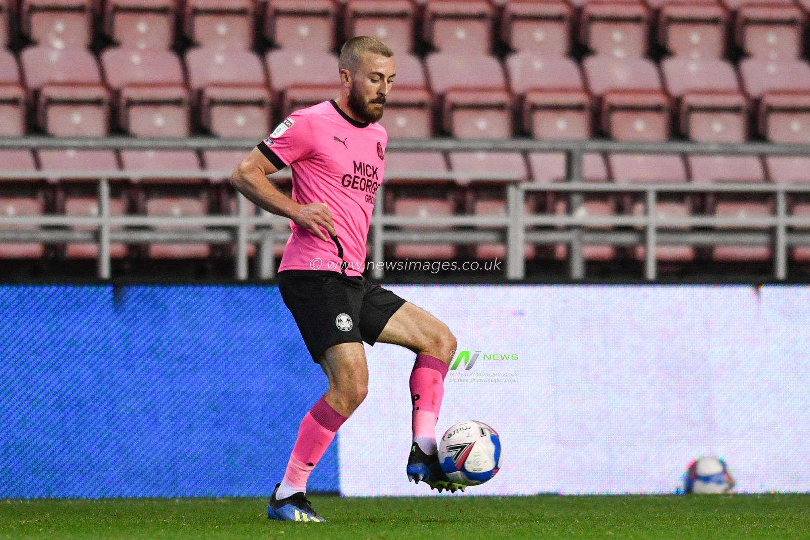 Dan Butler (3) of Peterborough United controls the ball