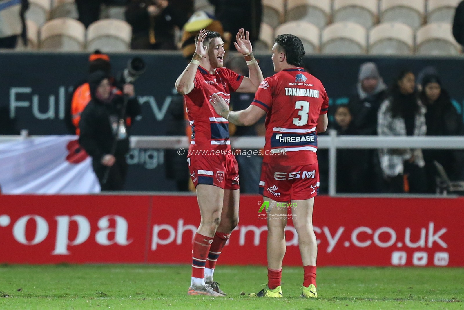 Sam Wood #24 and Brad Takairangi #3 of Hull KR enjoy the victory over Castleford