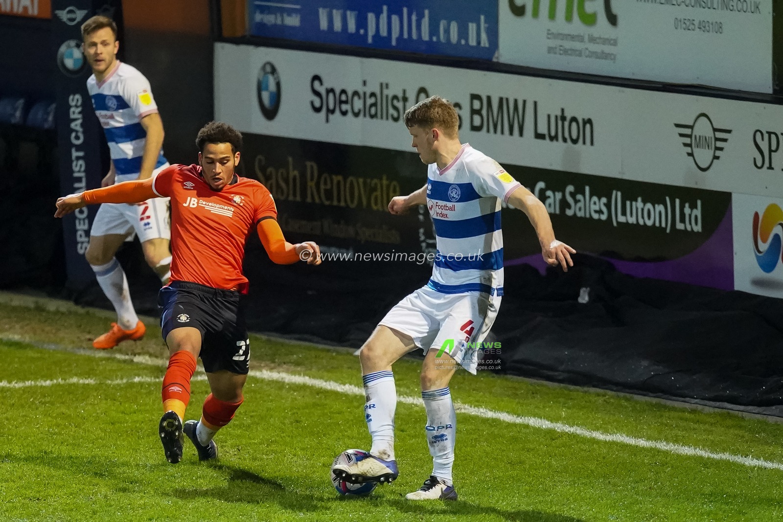 Rob Dickie #4 of Queens Park Rangers shows his ball skills on Sam Nombe #27 of Luton Town