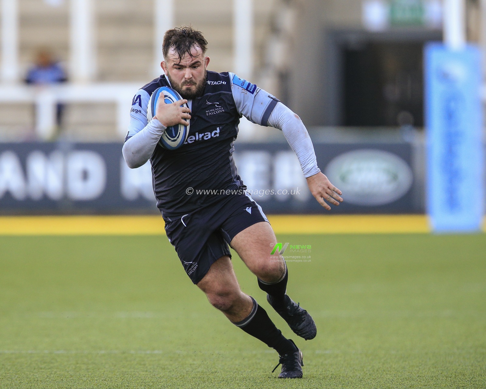 George McGuigan of Newcastle Falcons carries the ball forward
