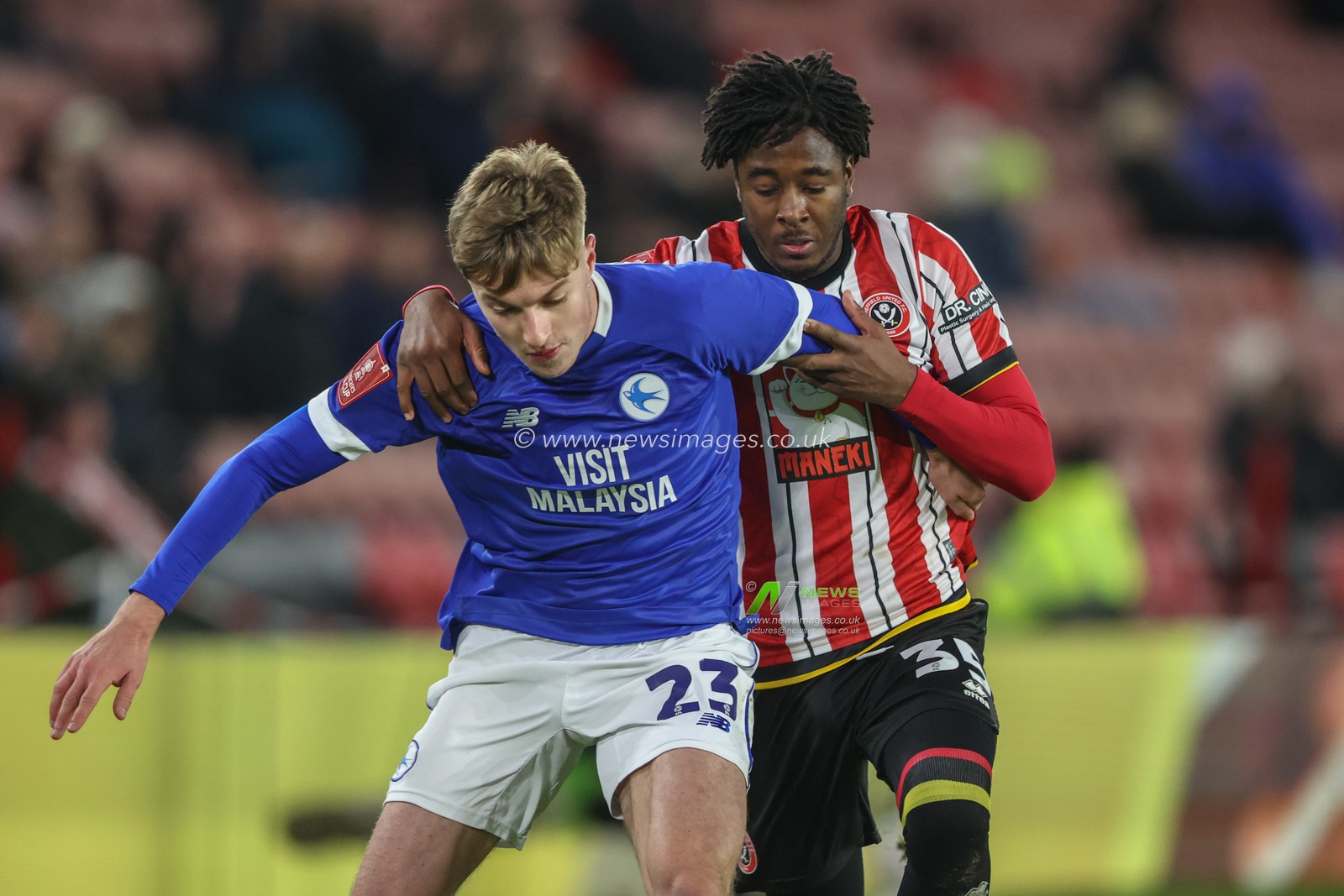 Joel Bagan of Cardiff City and Andre Brooks of Sheffield United battle for the ball during the Emirates FA Cup 3rd Round match Sheffield United vs Cardiff City at Bramall Lane, Sheffield, United Kingdom, 9th January 2025

(Photo by Alfie Cosgrove/News Images)