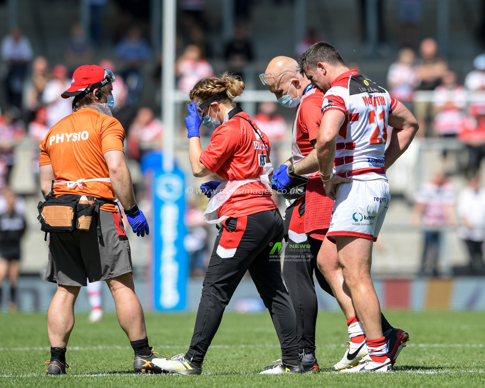 Tyrone McCarthy (21) of Leigh Centurions leaves the pitch after picking up an injury