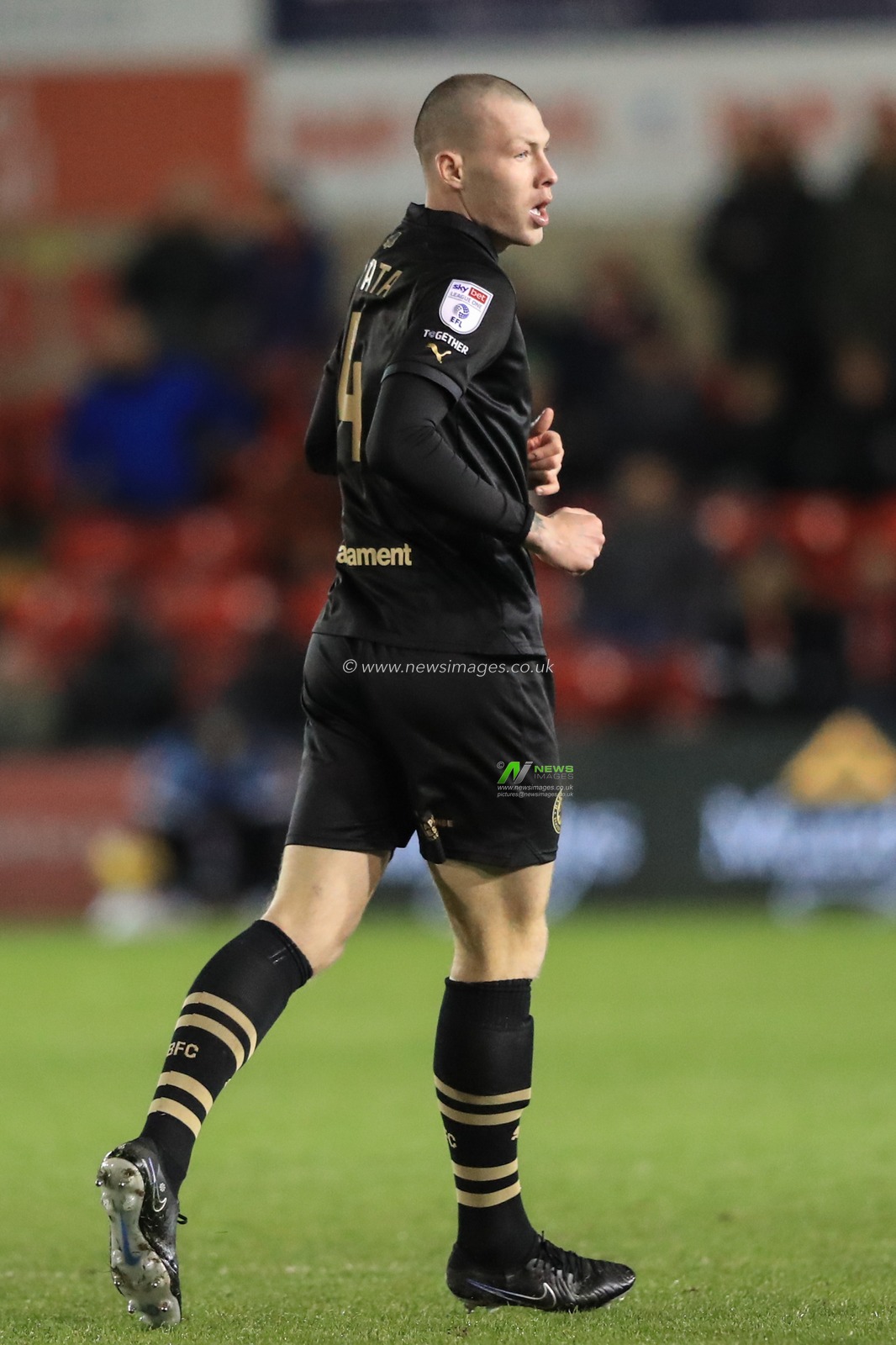 Kacper Åopata #4 of Barnsley during the Sky Bet League 1 match Lincoln City vs Barnsley at Gelder Group Sincil Bank Stadium, Lincoln, United Kingdom, 25th November 2023

(Photo by Alfie Cosgrove/News Images)