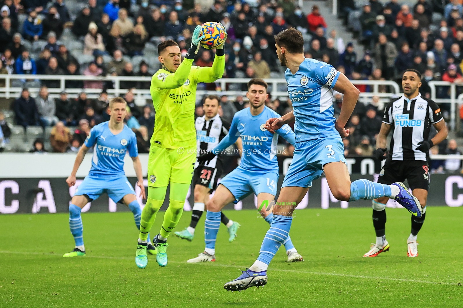 Ederson #31 of Manchester City claims the ball from the cross