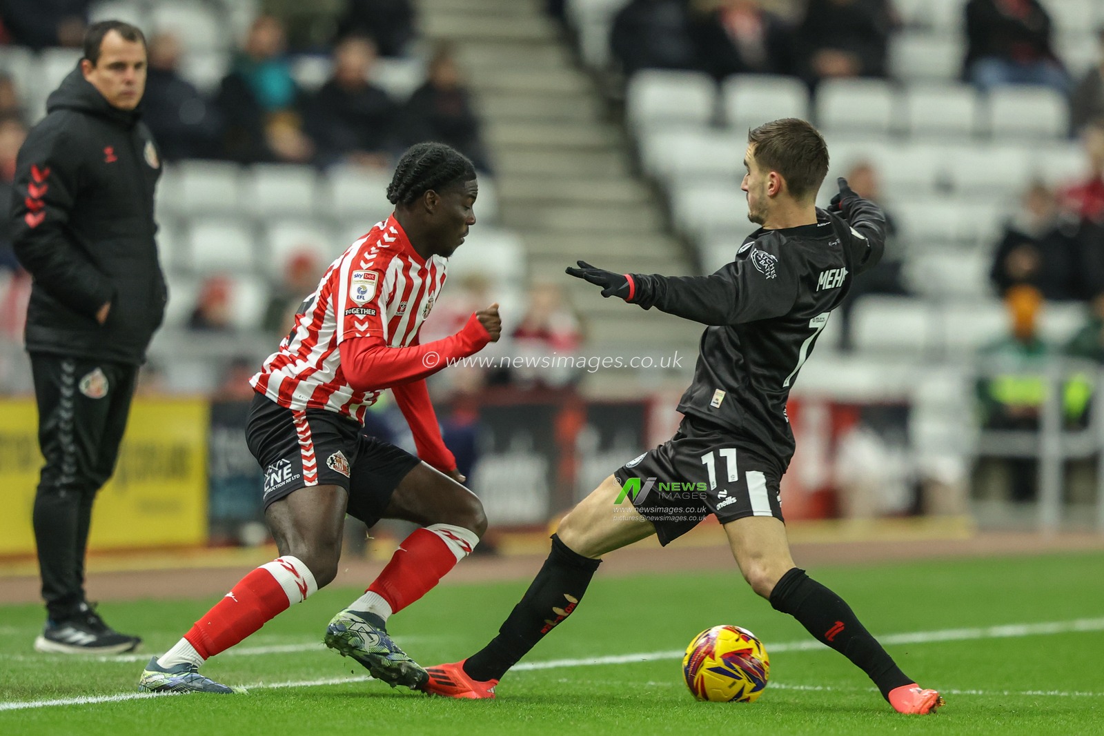 Eliezer Mayenda of Sunderland is fouled by Anis Mehmeti of Bristol City during the Sky Bet Championship match Sunderland vs Bristol City at Stadium Of Light, Sunderland, United Kingdom, 10th December 2024

(Photo by Alfie Cosgrove/News Images)