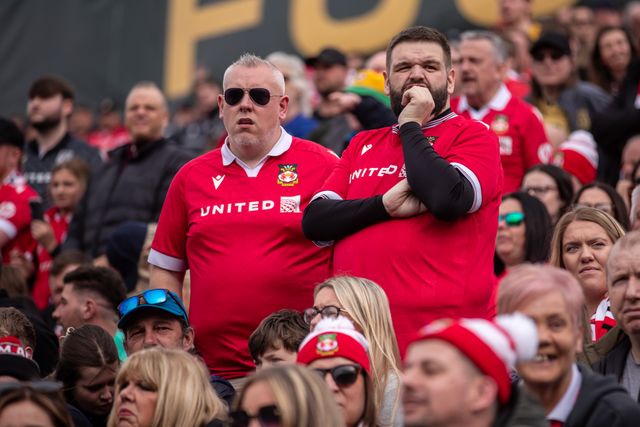 Wrexham fans look on during the Sky Bet League 1 match Wrexham vs Stockport County at SToK Cae Ras, Wrexham, United Kingdom, 22nd March 2025

(Photo by Nik Mesney/News Images)