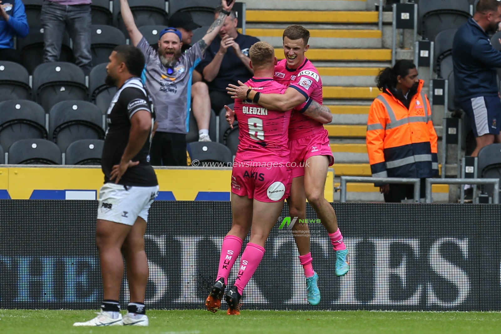 Ash Handley #5 of Leeds Rhinos celebrates his 5th try of the match to make it 16-60