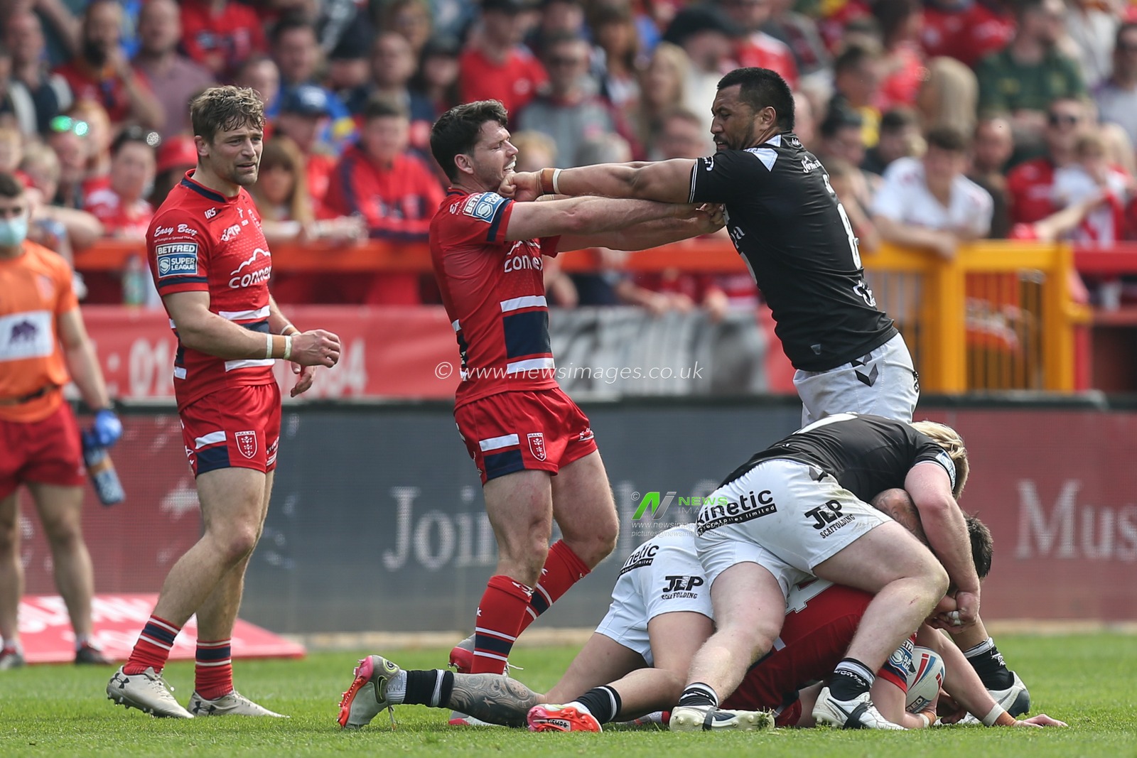 Lachlan Coote #1 of Hull KR and Ligi Sao #8 of Hull FC exchange blows