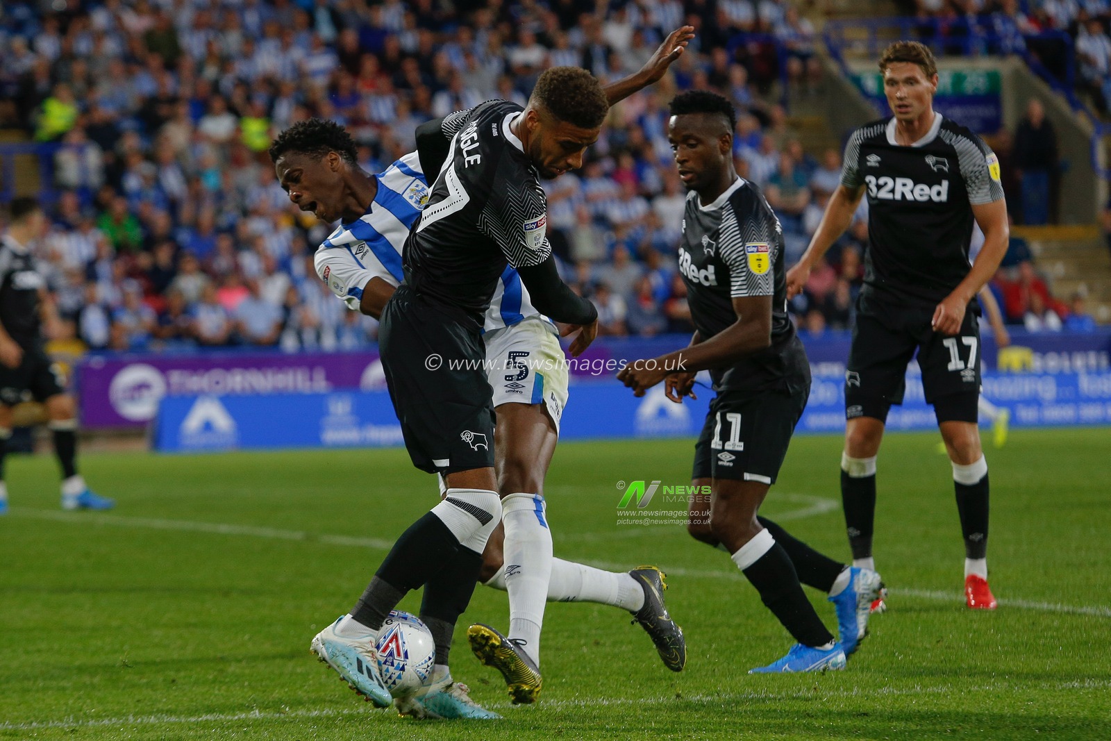 5th August 2019, John Smiths Stadium, Huddersfield England; Sky Bet Championship, Huddersfield Town vs Derby County ; Terence Kongolo (5) of Huddersfield Town is blocked by Jayden Bogle (37) of Derby County 

Credit: Kurt Fairhurst/News Images

English Football League images are subject to DataCo Licence