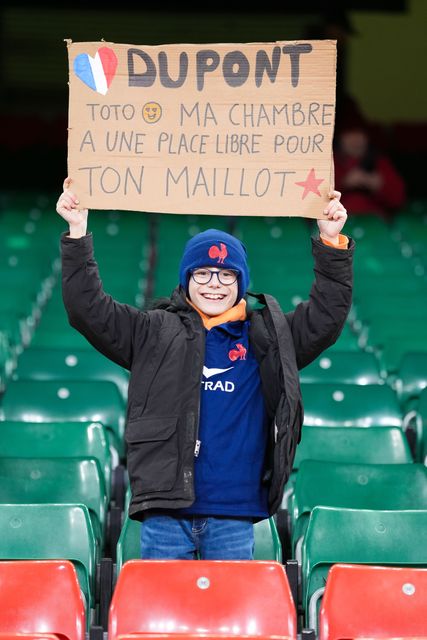 A young French fan holds up a sign for Antoine Dupont during the Guinness Six Nations match Wales vs France at Principality Stadium, Cardiff, United Kingdom, 15th February 2026

(Photo by Andrew Lewis/News Images)