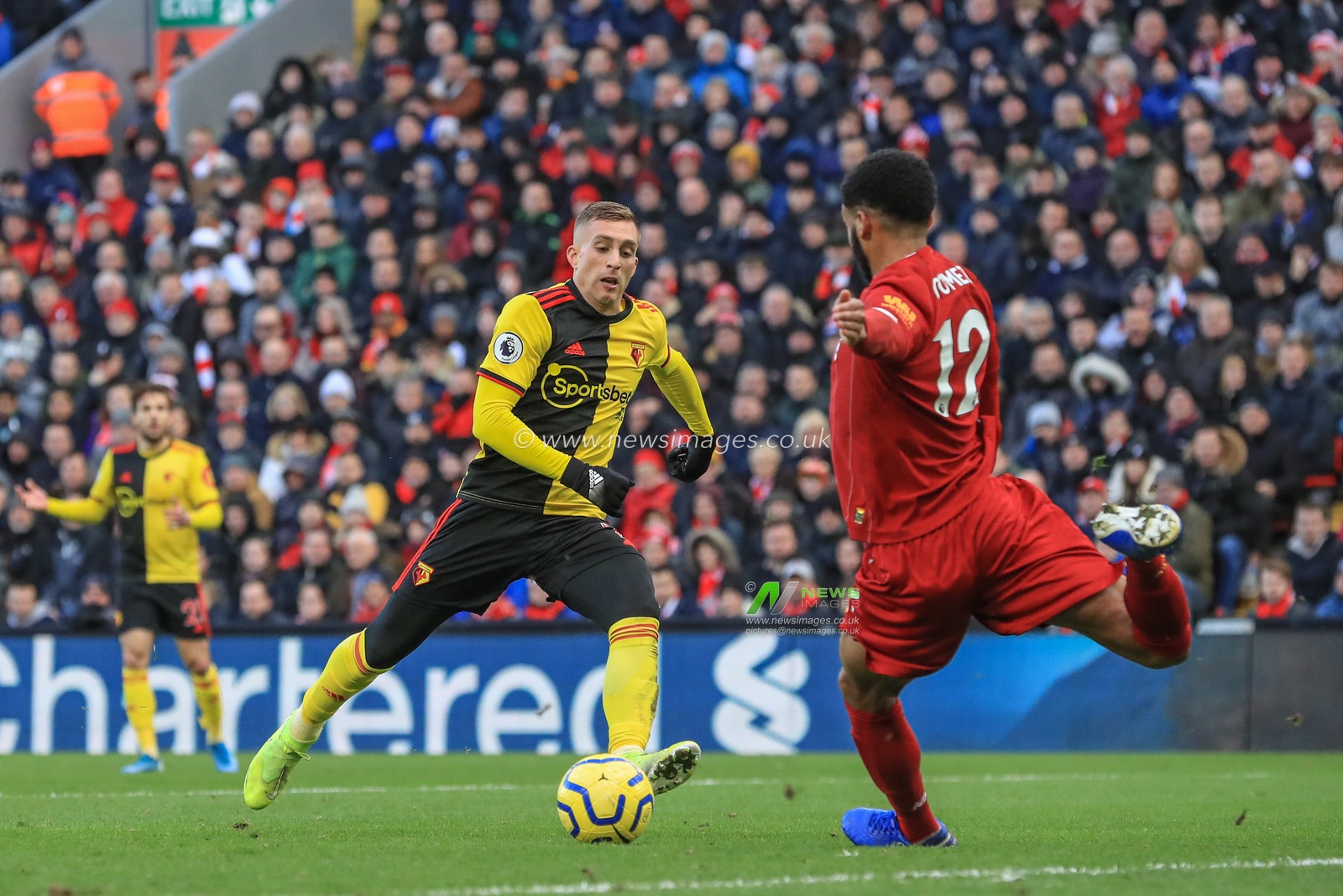 14th December 2019, Anfield, Liverpool, England; Premier League, Liverpool v Watford :  Gerard Deulofeu (7) of Watford and Joe Gomez (12) of Liverpool dual for the ball 

Credit: Mark Cosgrove/News Images