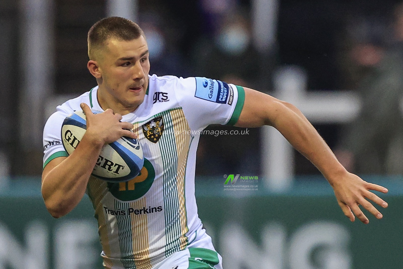 Ollie Sleightholme of Northampton Saints carries the ball