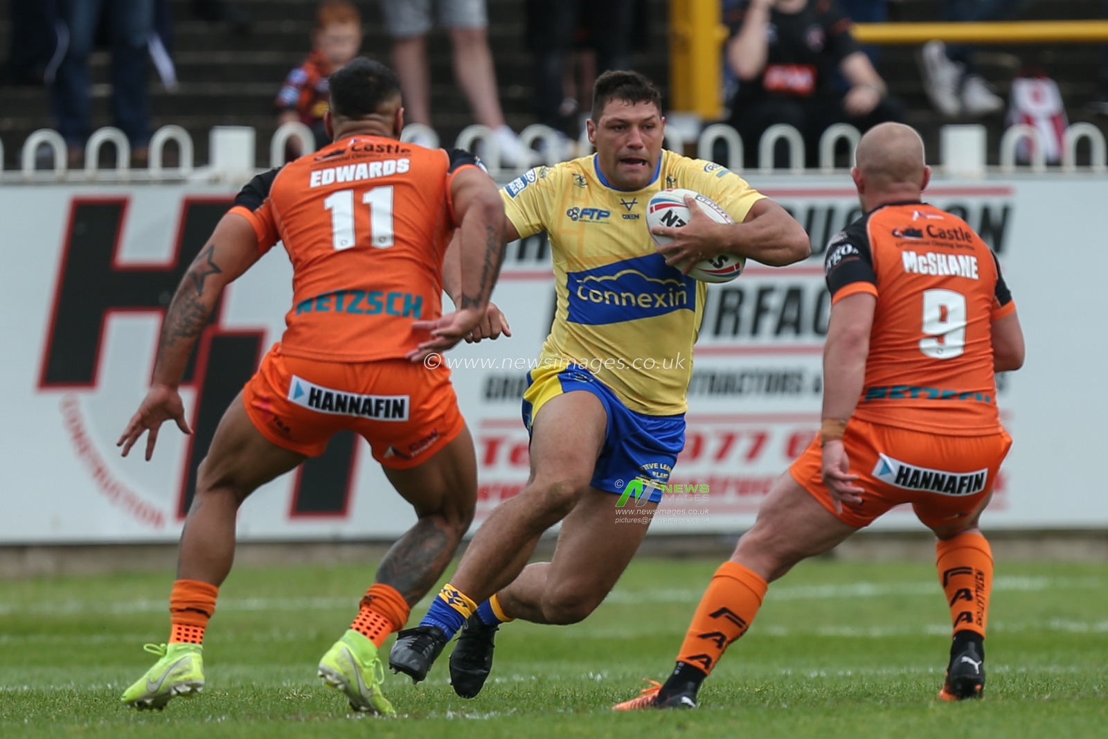 Ryan Hall #5 of Hull KR runs at Paul McShane #9 of Castleford Tigers