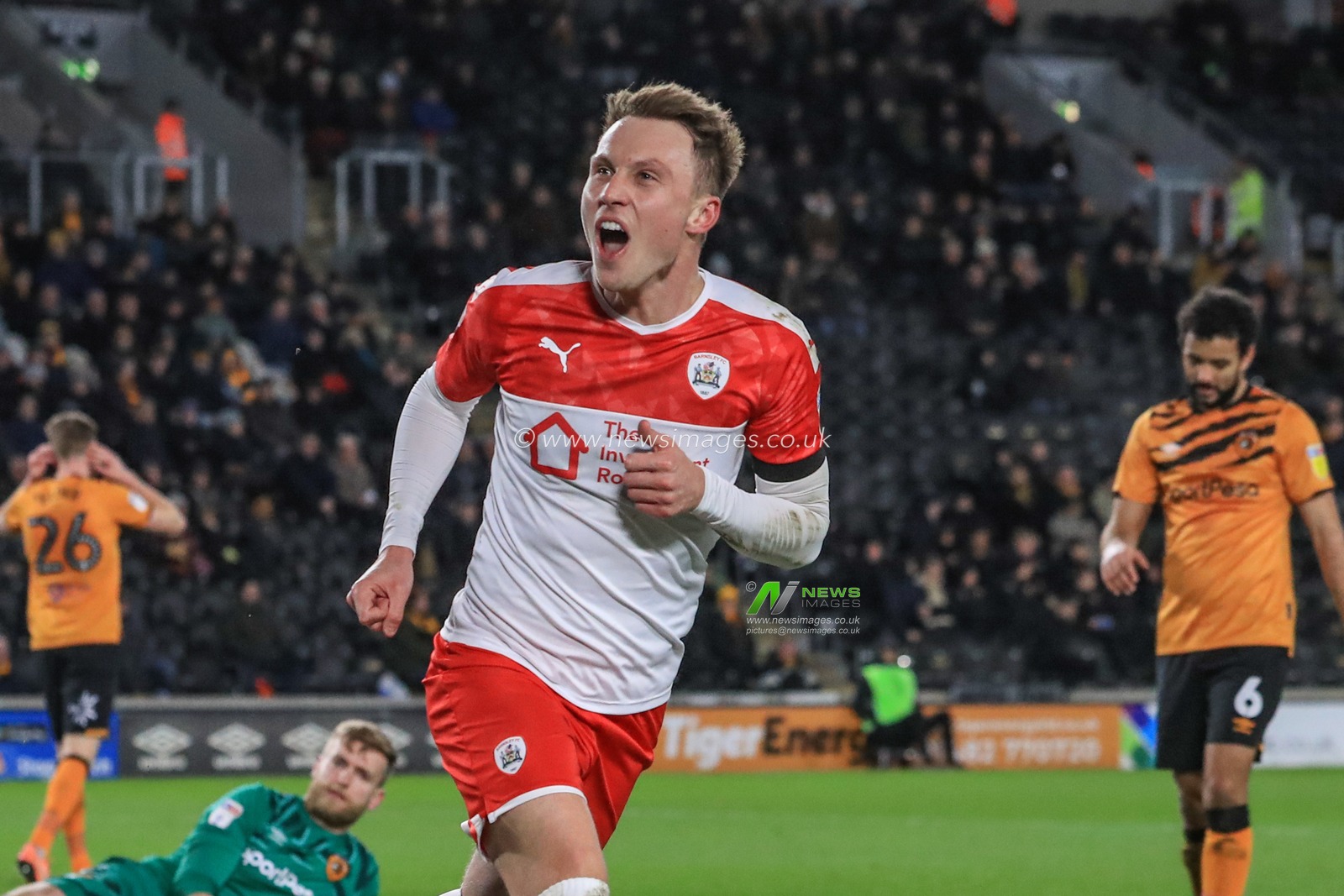 26th February 2020, KC Stadium, Kingston upon Hull, England; Sky Bet Championship, Hull City v Barnsley : Cauley Woodrow (9) of Barnsley celebrates his goal to make it 0-1