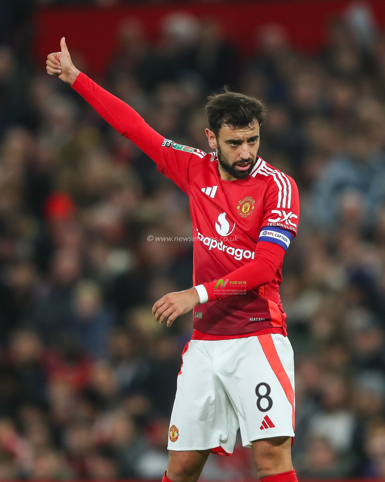 Bruno Fernandes of Manchester United give the thumbs up to team mates during the Carabao Cup Last 16 match Manchester United vs Leicester City at Old Trafford, Manchester, United Kingdom, 30th October 2024

(Photo by Gareth Evans/News Images)