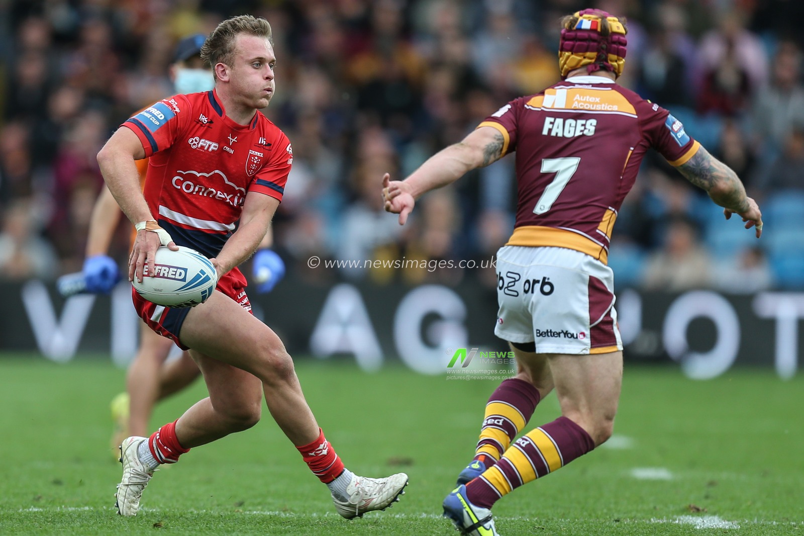 Jez Litten #14 of Hull KR looks to pass the ball