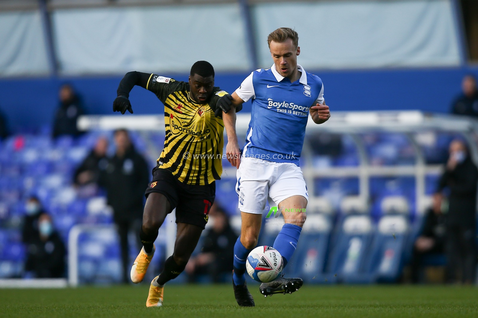 Maikel Kieftenbeld #6 of Birmingham City passes the ball under pressure from Ken Sema #12 of Watford