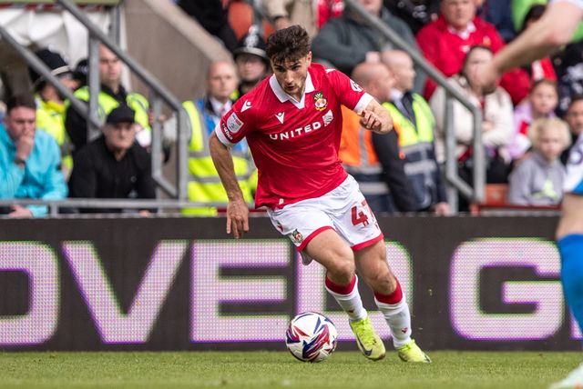 Wrexham's Ryan Longman carries the ball during the Sky Bet League 1 match Wrexham vs Stockport County at SToK Cae Ras, Wrexham, United Kingdom, 22nd March 2025

(Photo by Nik Mesney/News Images)