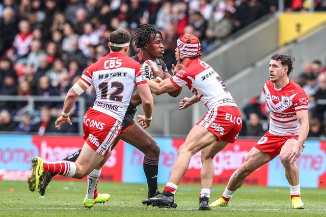 Junior Nsemba of Wigan Warriors is tackled by Harry Robertson of St Helens during the Betfred Super League round 7 match St Helens vs Wigan Warriors at The BrewDog Stadium, St Helens, United Kingdom on 03 April 2026

(Photo by Alfie Cosgrove/News Images)