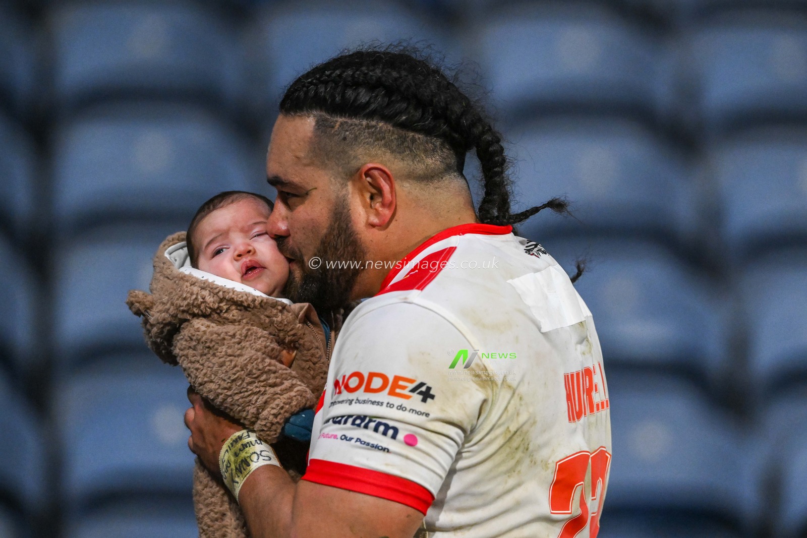 Konrad Hurrell #23 of St Helens gives his young child a kiss at the end of the Betfred Super League Round 6 match Huddersfield Giants vs St Helens at John Smith's Stadium, Huddersfield, United Kingdom, 23rd March 2023

(Photo by Craig Thomas/News Images)