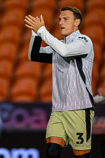 Kal Naismith of Luton Town  acknowledges the travelling supporters prior to the Sky Bet League 1 match Blackpool vs Luton Town at Bloomfield Road, Blackpool, United Kingdom, 30th September 2025

(Photo by Adam Gee/News Images)