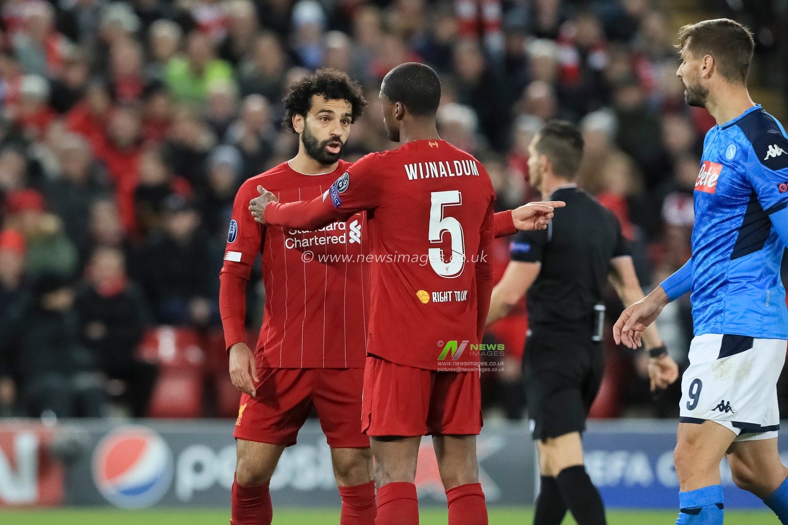 27th November 2019, Anfield, Liverpool, England; UEFA Champions League, Liverpool v Napoli : Georginio Wijnaldum (5) of Liverpool talks with Mohamed Salah (11) of Liverpool 

Credit: Mark Cosgrove/News Images