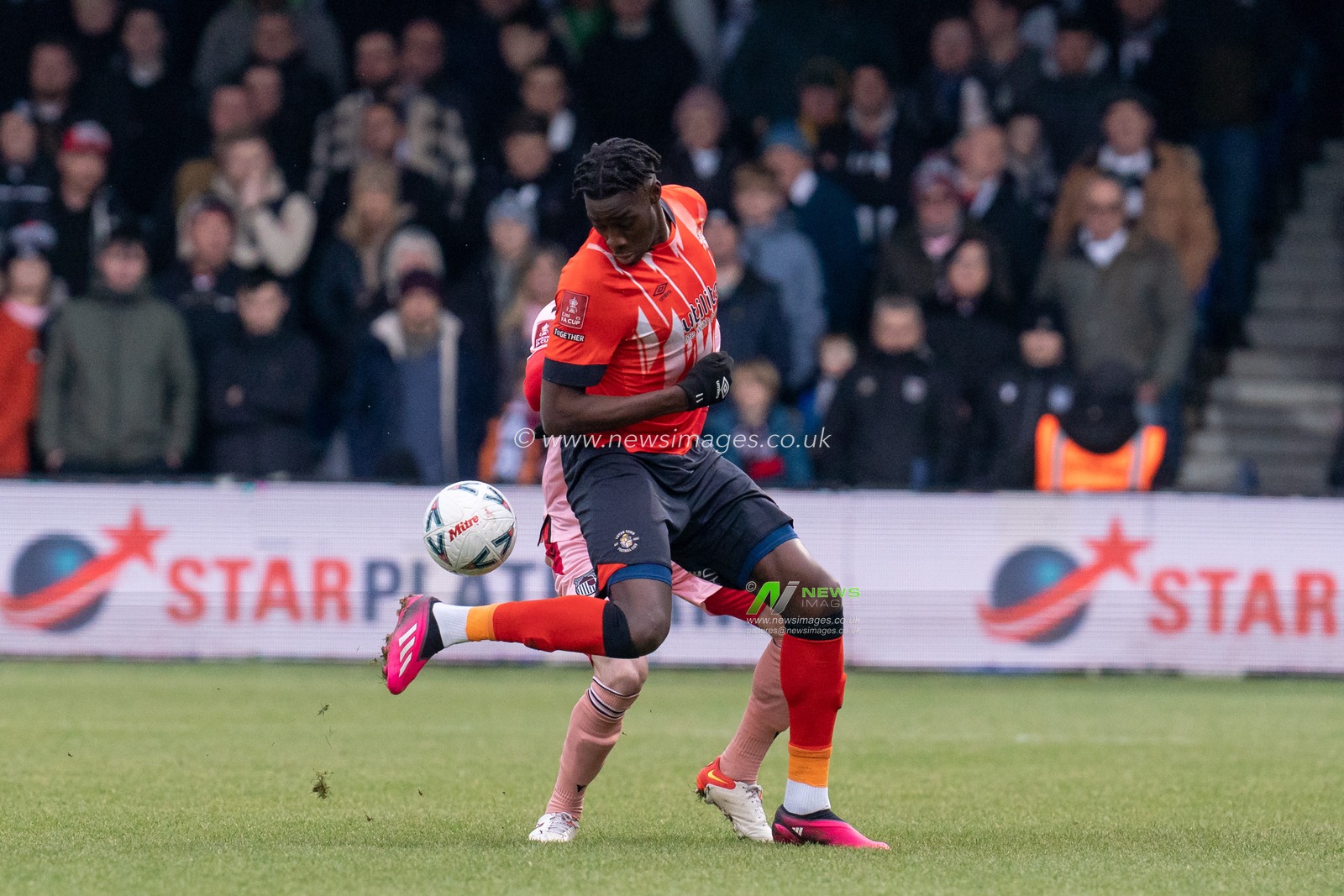 Elijah Adebayo #11 of Luton Town battles with  Niall Maher #31 of Grimsby Town during the Emirates FA Cup Fourth Round match Luton Town vs Grimsby Town at Kenilworth Road, Luton, United Kingdom, 28th January 2023

(Photo by Richard Washbrooke/News Images)
