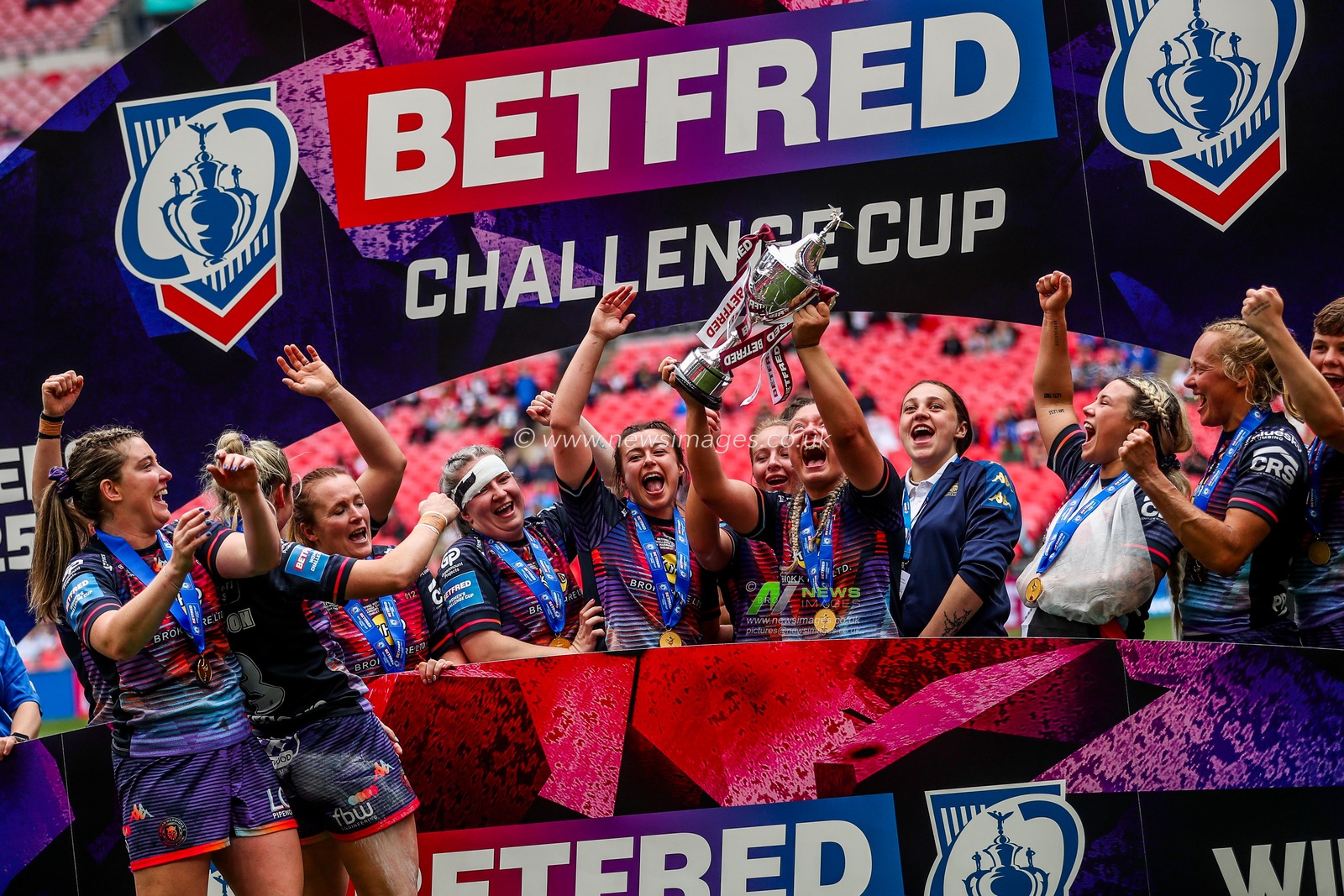 Wigan Warriors lift the Challenge Cup after the teams victory following the Betfred Women's Challenge Cup Final St Helens vs Wigan Warriors at Wembley Stadium, London, United Kingdom, 7th June 2025

(Photo by Izzy Poles/News Images)