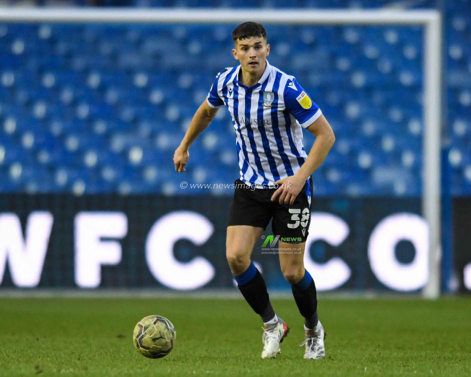 Jordan Storey #38 of Sheffield Wednesday looks for a passing option