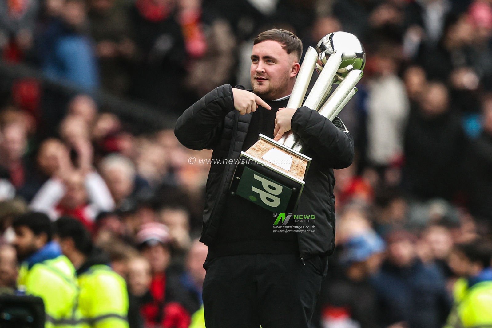 Luke ‘The Nuke’ Littler shows his PDC World Championship trophy after winning it for his second consecutive year during the Premier League match Manchester United vs Tottenham Hotspur at Old Trafford, Manchester, United Kingdom on 07 February 2026

(Photo by Alfie Cosgrove/News Images)