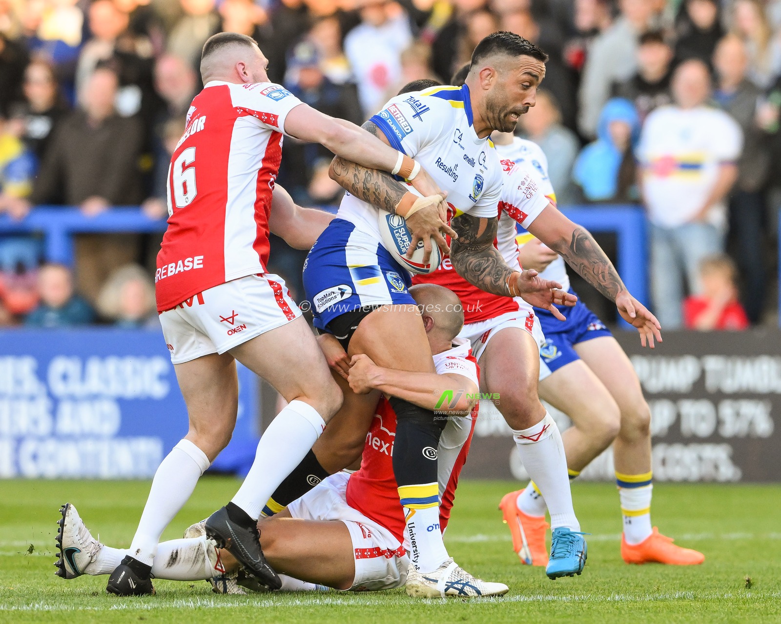 Paul Vaughan #10 of Warrington Wolves is tackled by Dean Hadley #22 of Hull KR during the Betfred Super League Round 12 match Warrington Wolves vs Hull KR at Halliwell Jones Stadium, Warrington, United Kingdom, 12th May 2023

(Photo by Craig Thomas/News Images)