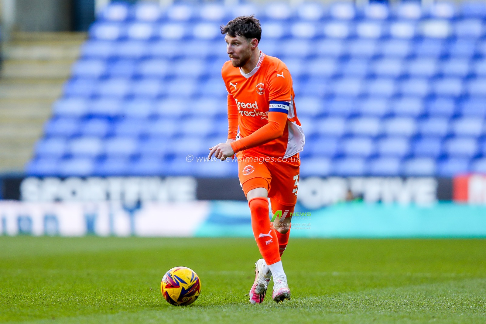 James Husband of Blackpool runs with the ball during the Sky Bet League 1 match Reading vs Blackpool at Select Car Leasing Stadium, Reading, United Kingdom, 14th December 2024

(Photo by Izzy Poles/News Images)