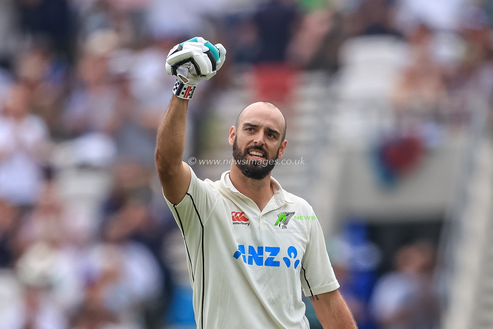 Daryl Mitchell of New Zealand celebrates a century (100 runs)