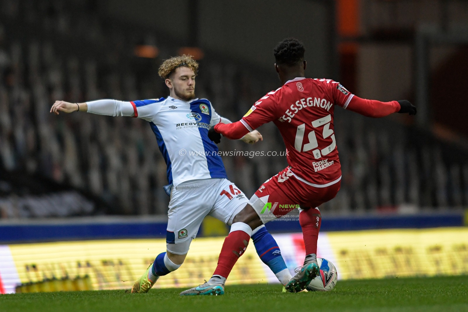 Harvey Elliott #16 of Blackburn Rovers and Steven Sessegnon #43 of Bristol City compete for the ball